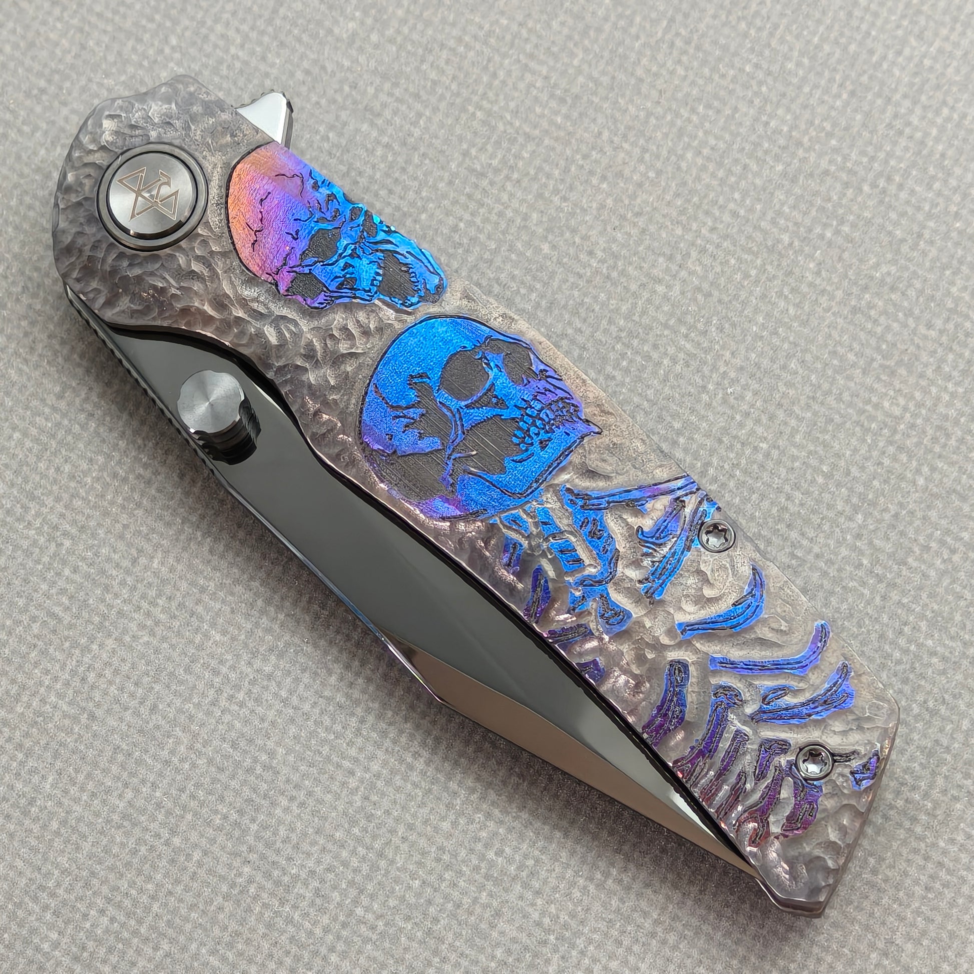 VORIXN Skull Nocturne KB120 Folding Knife – closed non-clip side view showing hand-engraved anodized titanium handle design and pivot