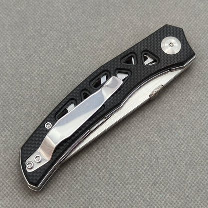 VORIXN KA003 closed clip-side view with pocket clip, screws, and G10 handle back.