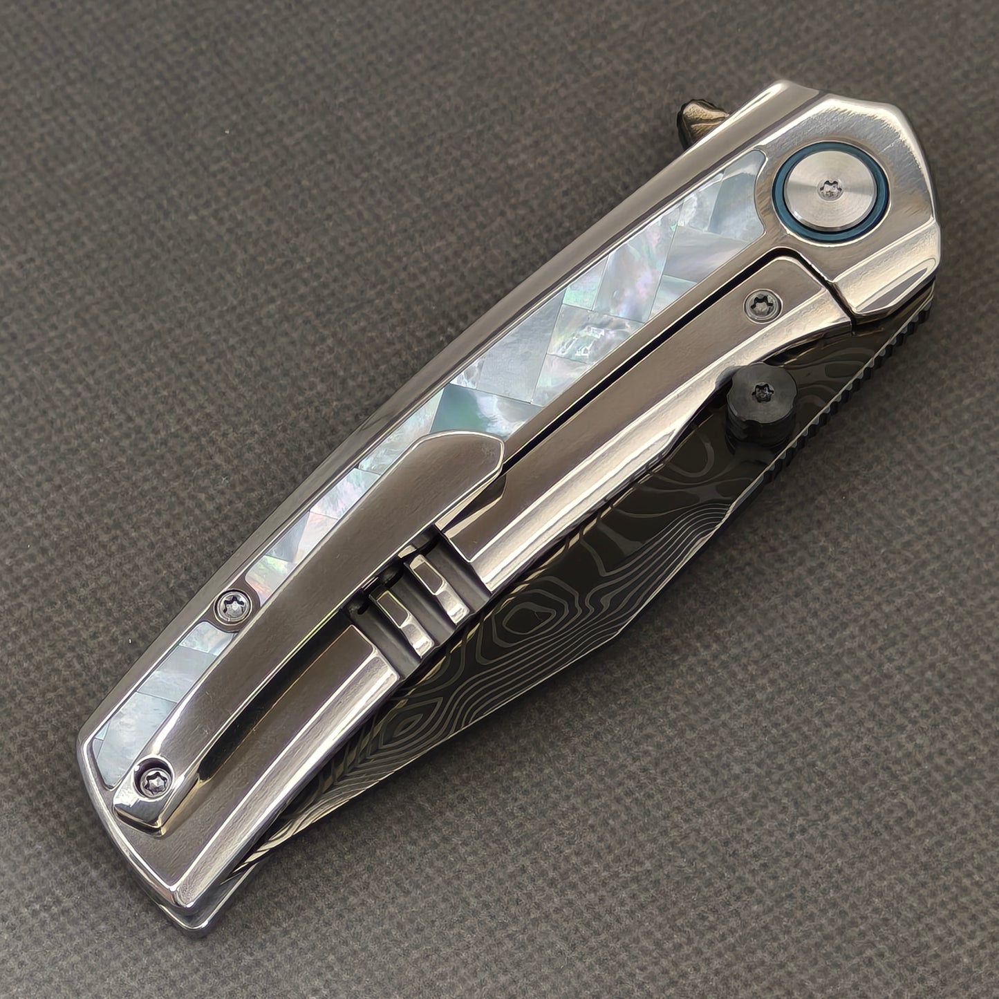 VORIXN Ocean Mirage KB104 Folding Knife – closed clip side view with pocket clip and Mother-of-Pearl Inlaid Titanium handle back