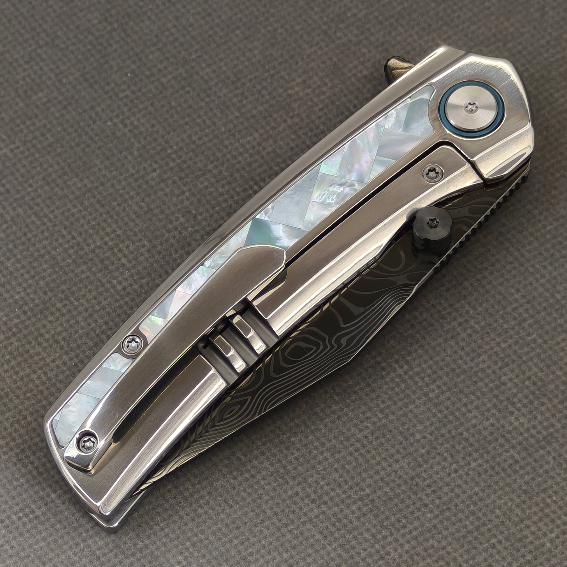 VORIXN Ocean Mirage KB104 Folding Knife – closed clip side view with pocket clip and Mother-of-Pearl Inlaid Titanium handle back