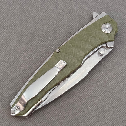 VORIXN KA007 closed clip-side view with pocket clip, screws, and G10 handle back.