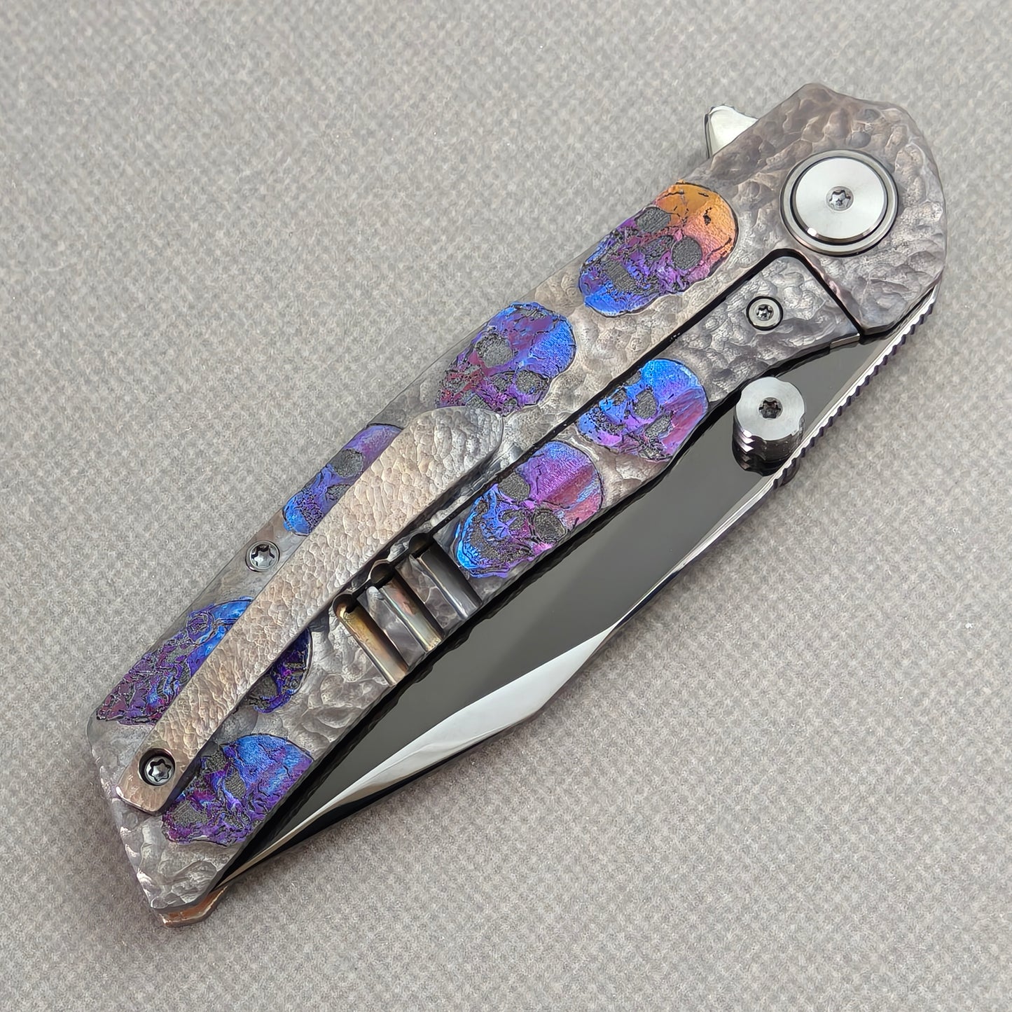 VORIXN Skull Nocturne KB120 Folding Knife – closed clip side view with pocket clip and anodized titanium handle back