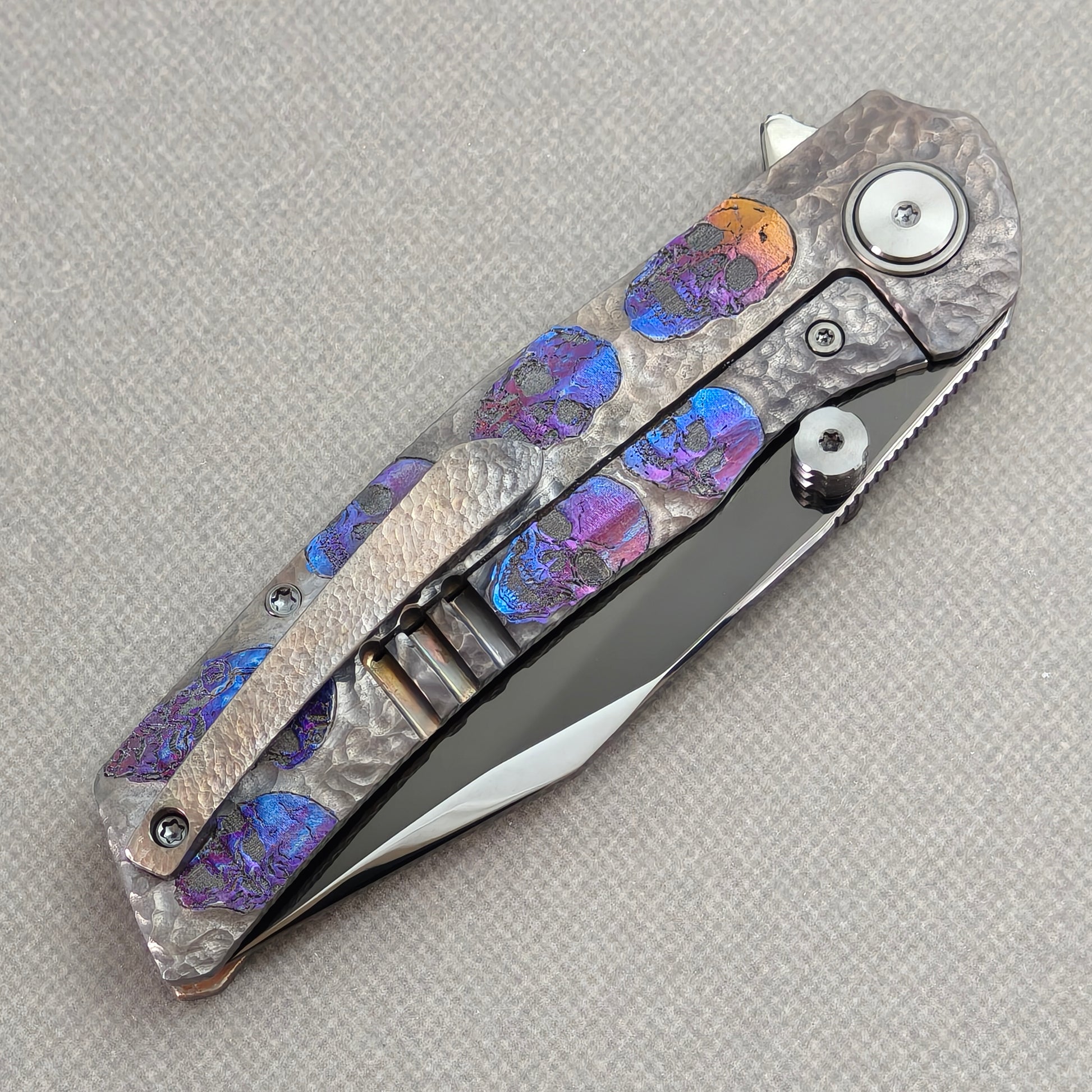 VORIXN Skull Nocturne KB120 Folding Knife – closed clip side view with pocket clip and anodized titanium handle back