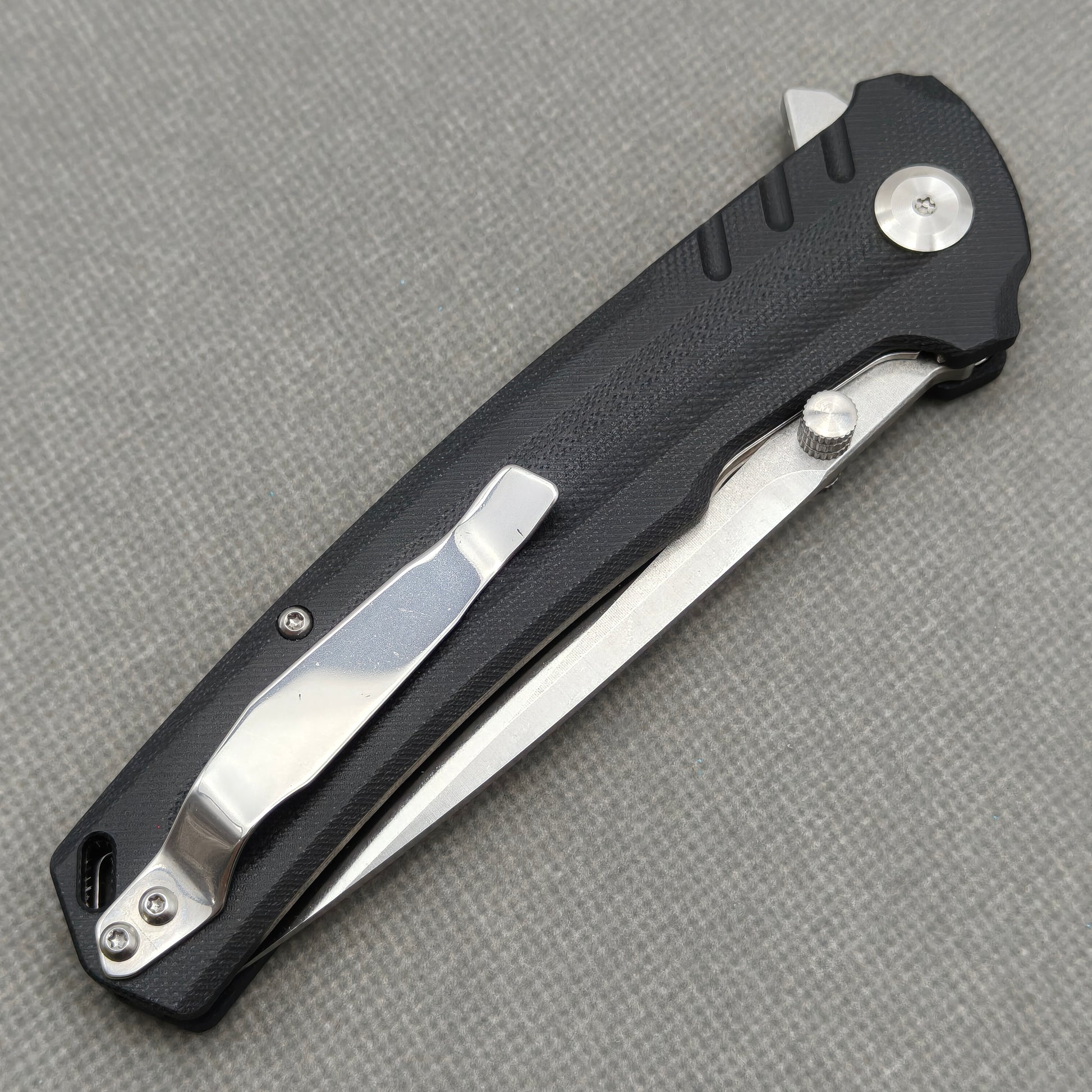 VORIXN KA001 closed clip-side view with pocket clip, screws, and G10 handle back.