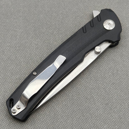 VORIXN KA001 closed clip-side view with pocket clip, screws, and G10 handle back.