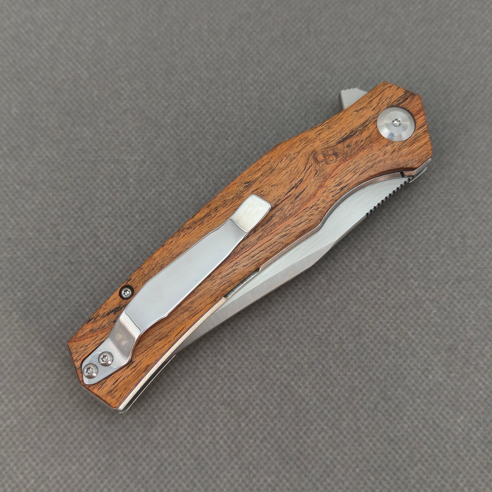 VORIXN KA013 closed clip-side view with pocket clip, screws, and sandalwood handle back.