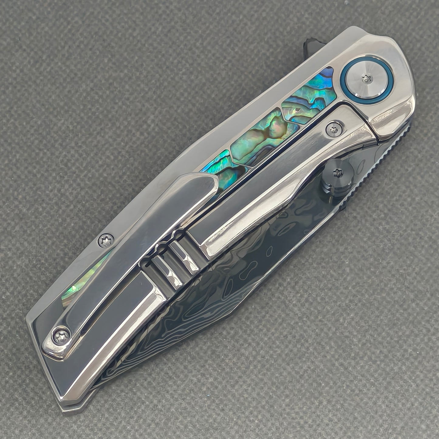 VORIXN Ocean Mirage KB130 Folding Knife – closed clip side view with pocket clip and titanium handle back