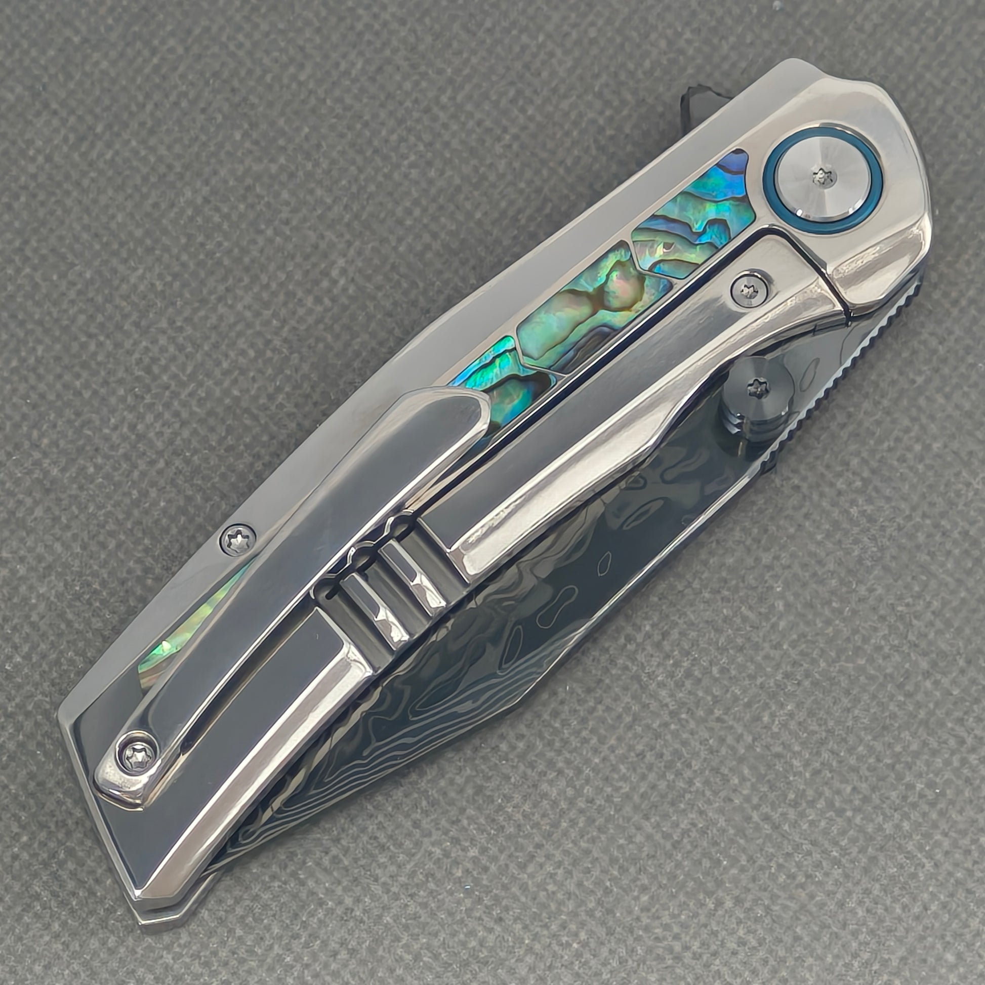 VORIXN Ocean Mirage KB130 Folding Knife – closed clip side view with pocket clip and titanium handle back