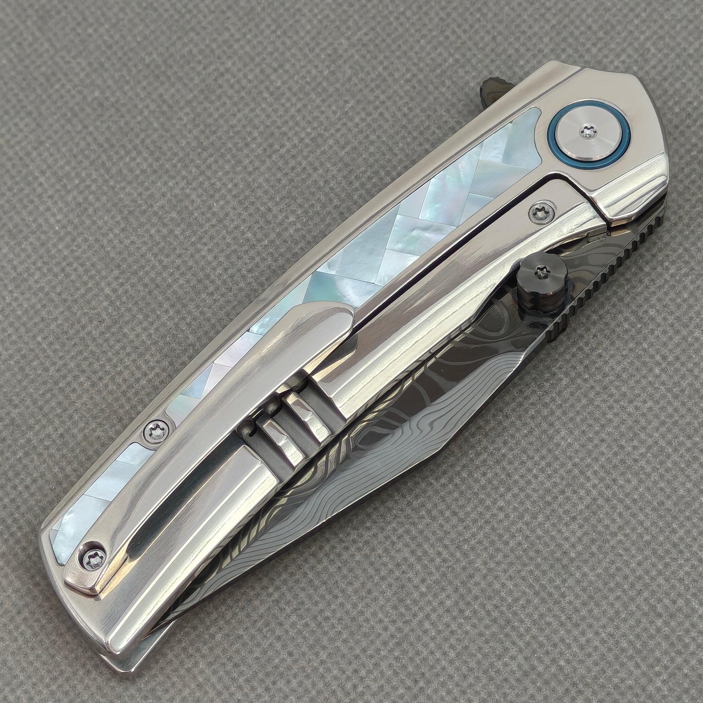 VORIXN KB104 Ocean Mirage Folding Knife – closed clip side view with pocket clip and Titanium handle back