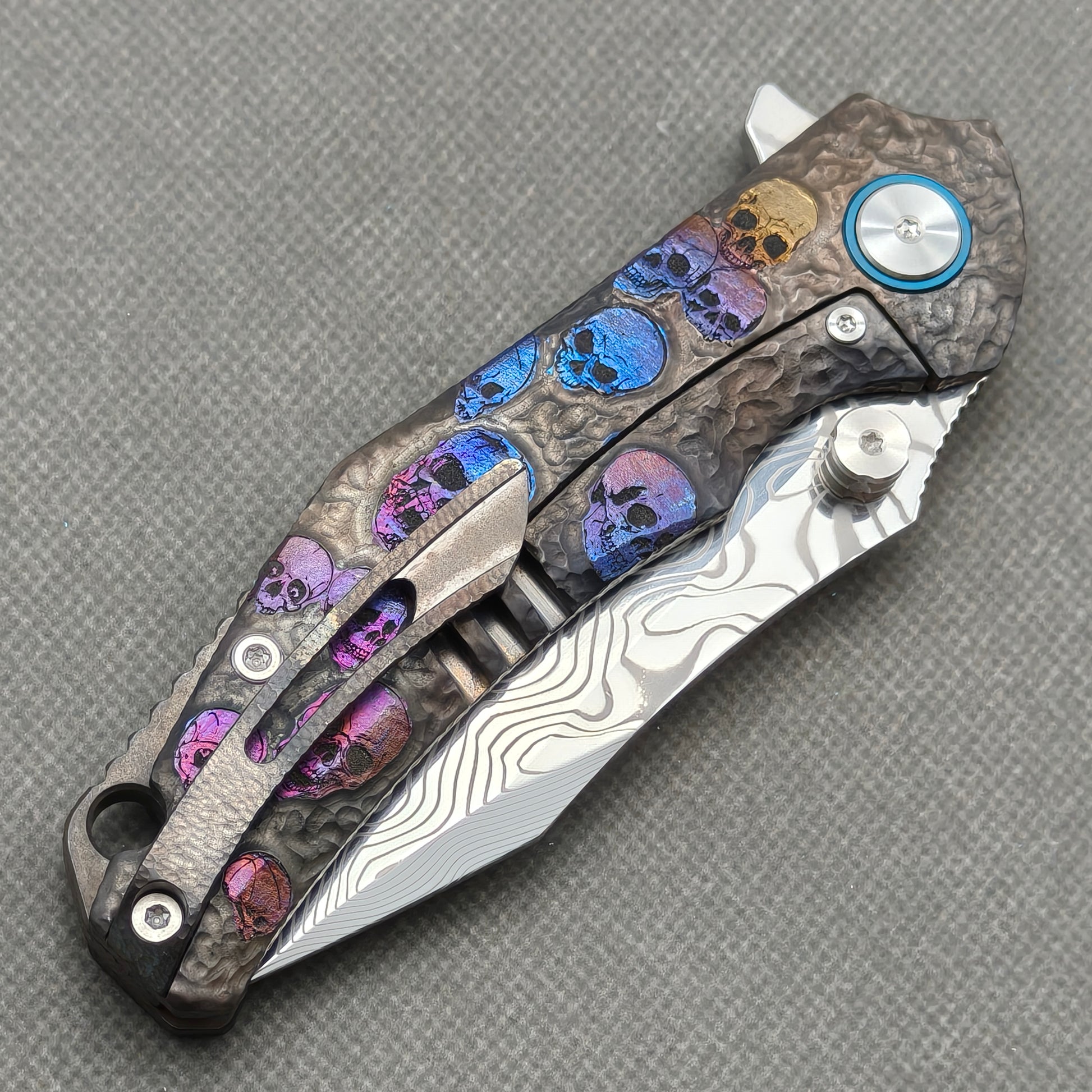 VORIXN KB096 closed clip-side view with pocket clip, screws, and engraved titanium handle back.
