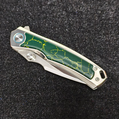 VORIXN Verdant folding knife closed non-clip side showing lab-created turquoise inlay pattern