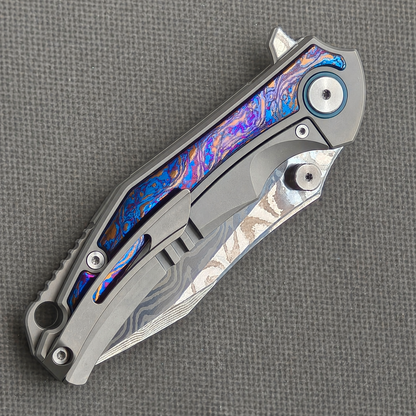 VORIXN KB031 closed clip-side view with pocket clip, screws, and flamed zirconium handle back.