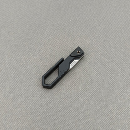 VORIXN NA001 Super Tiny Folding Knife – spine side view showing handle thickness and blade alignment