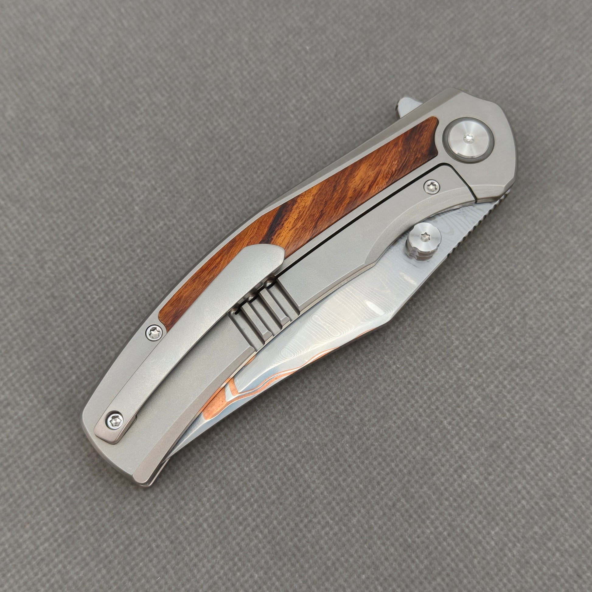 VORIXN KB074 closed clip-side view with pocket clip, screws, and ironwood handle back.