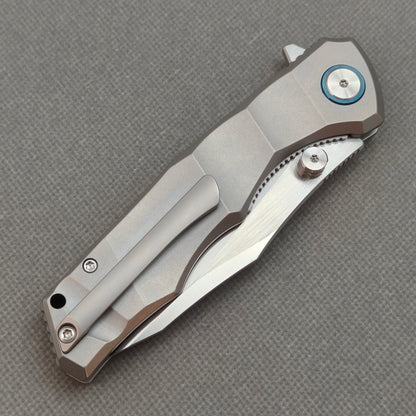 VORIXN KB014 closed clip-side view with pocket clip, screws, and metallic gray titanium handle.
