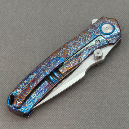 VORIXN KB051 closed clip-side view with pocket clip, screws, and flamed titanium handle back.