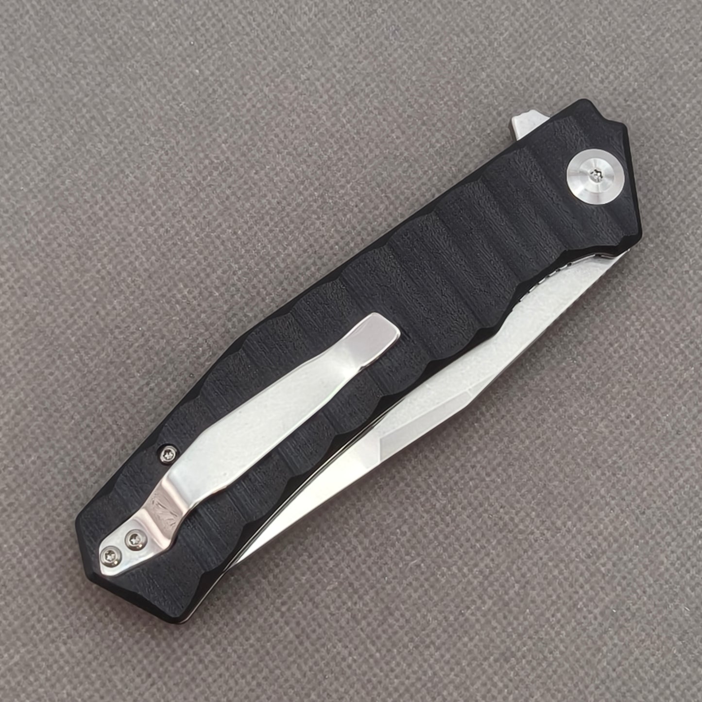 VORIXN KA002 closed clip-side view with pocket clip, screws, and G10 handle back.