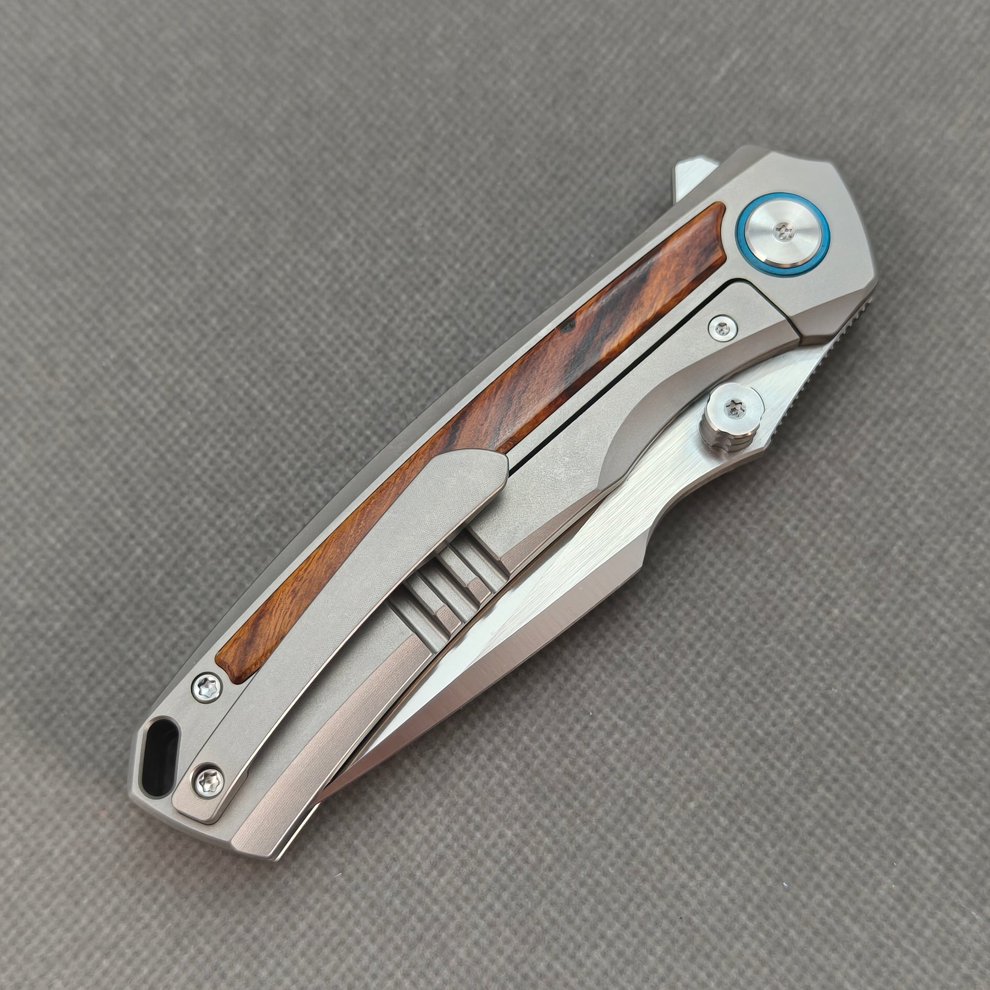 VORIXN KB040 closed clip-side view with pocket clip, screws, and ironwood handle back.