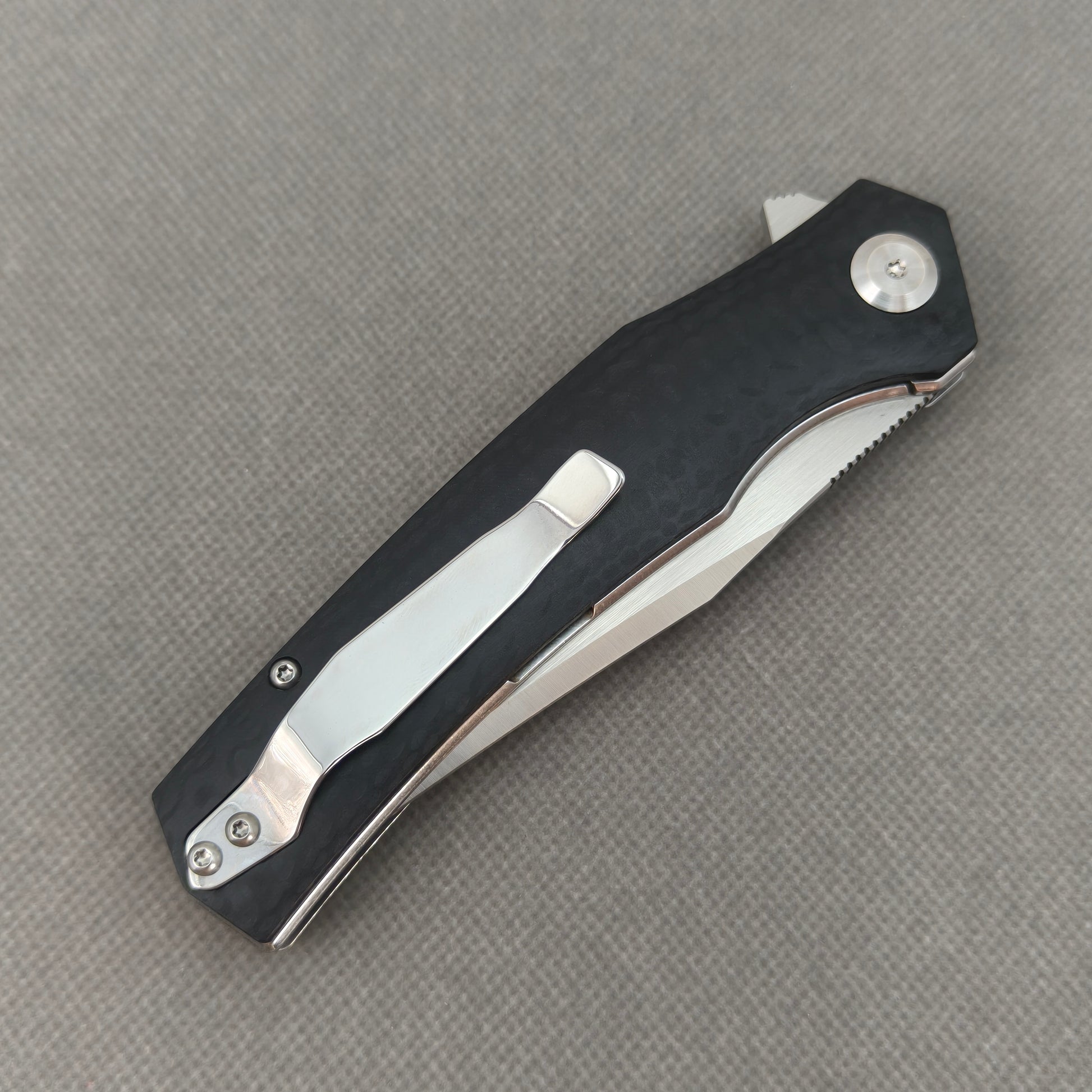 VORIXN KA006 closed clip-side view with pocket clip, screws, and G10 handle back.