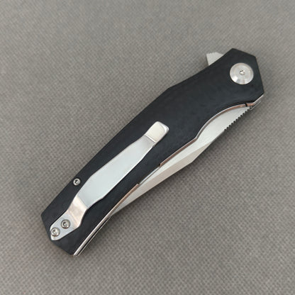 VORIXN KA006 closed clip-side view with pocket clip, screws, and G10 handle back.