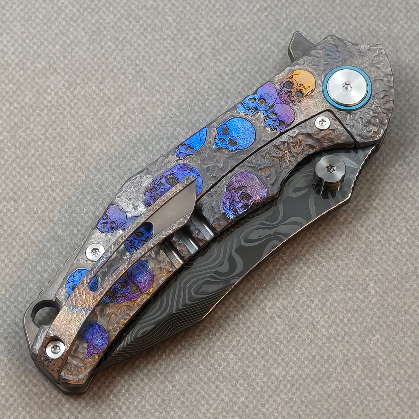VORIXN Skull Rift KB128 Folding Knife – closed clip side view with pocket clip and anodized titanium handle back