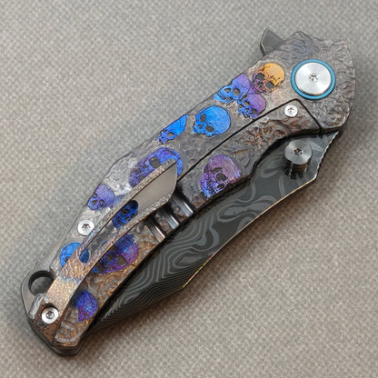 VORIXN Skull Rift KB128 Folding Knife – closed clip side view with pocket clip and anodized titanium handle back
