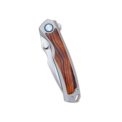 VORIXN Ironwood Crest folding knife closed on non-clip side, highlighting ironwood grain and titanium frame
