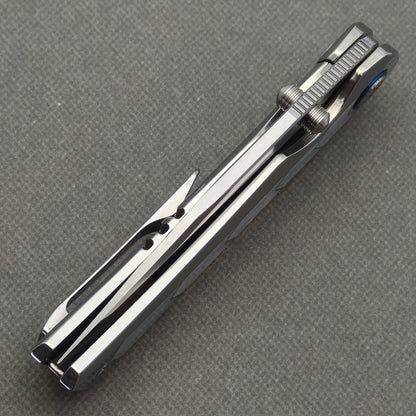 Spine view of the closed VORIXN Pearlglint KB159 showing the folded blade, dual thumb studs and pocket clip.