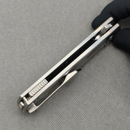 VORIXN KB059 closed side construction view showing pocket clip, spacer, and titanium handle layers.
