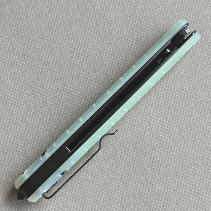 VORIXN KM004 closed side construction view showing pocket clip, spacer, and handle layers.