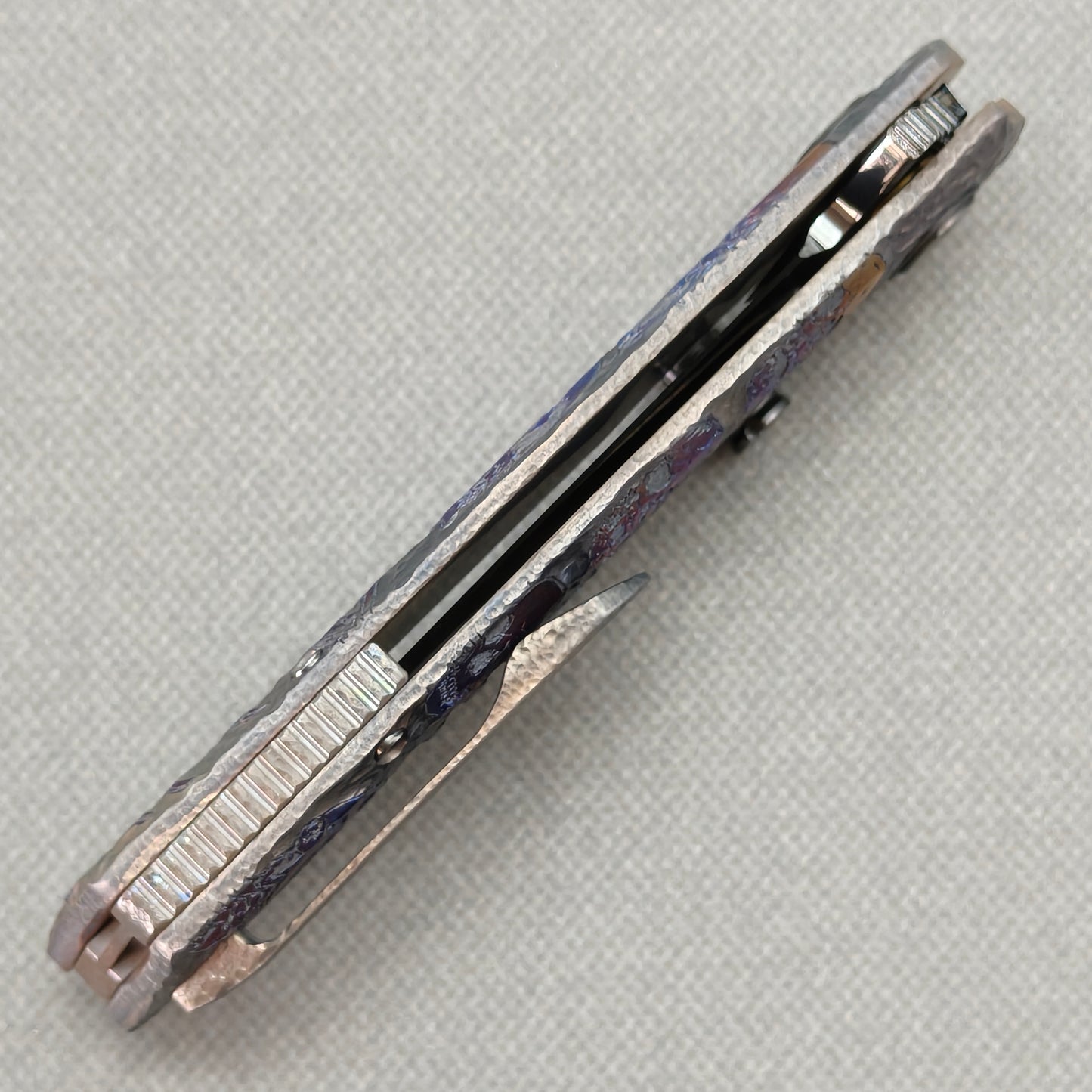VORIXN Skull Nocturne KB120 Folding Knife – closed side construction view showing pocket clip, spacer, and titanium handle layers