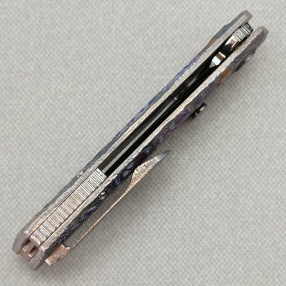 VORIXN Skull Nocturne KB120 Folding Knife – closed side construction view showing pocket clip, spacer, and titanium handle layers