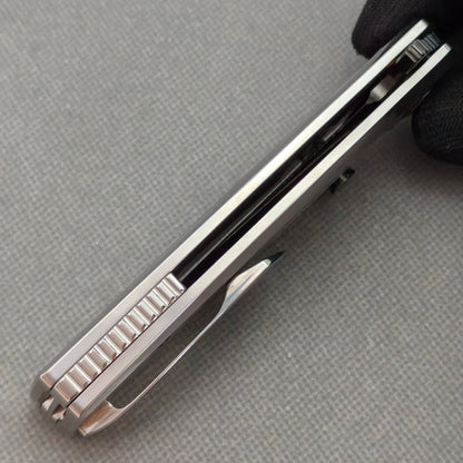 VORIXN KB103 Ocean Mirage Folding Knife – closed side construction view showing pocket clip, spacer, and handle layers
