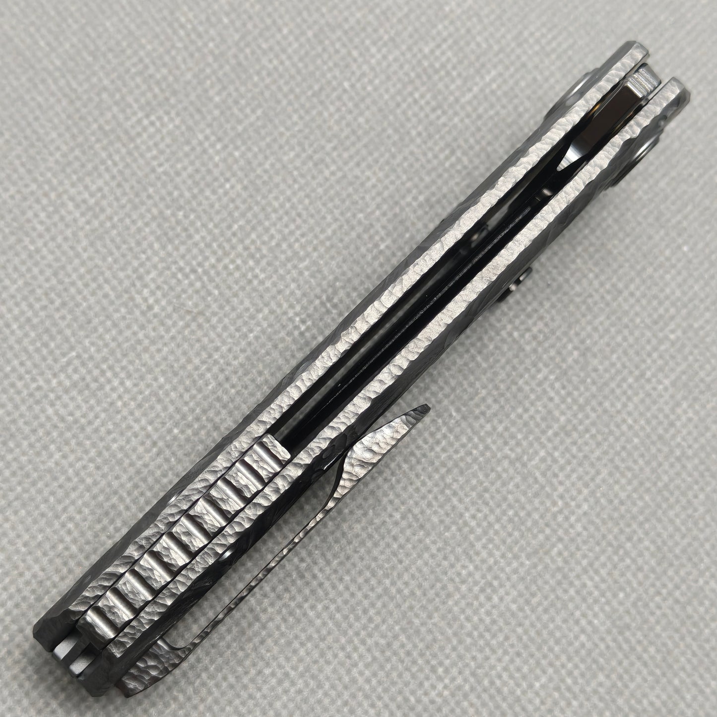 VORIXN KB098 Impact Origin Folding Knife – closed side construction view showing pocket clip, spacer, and handle layers