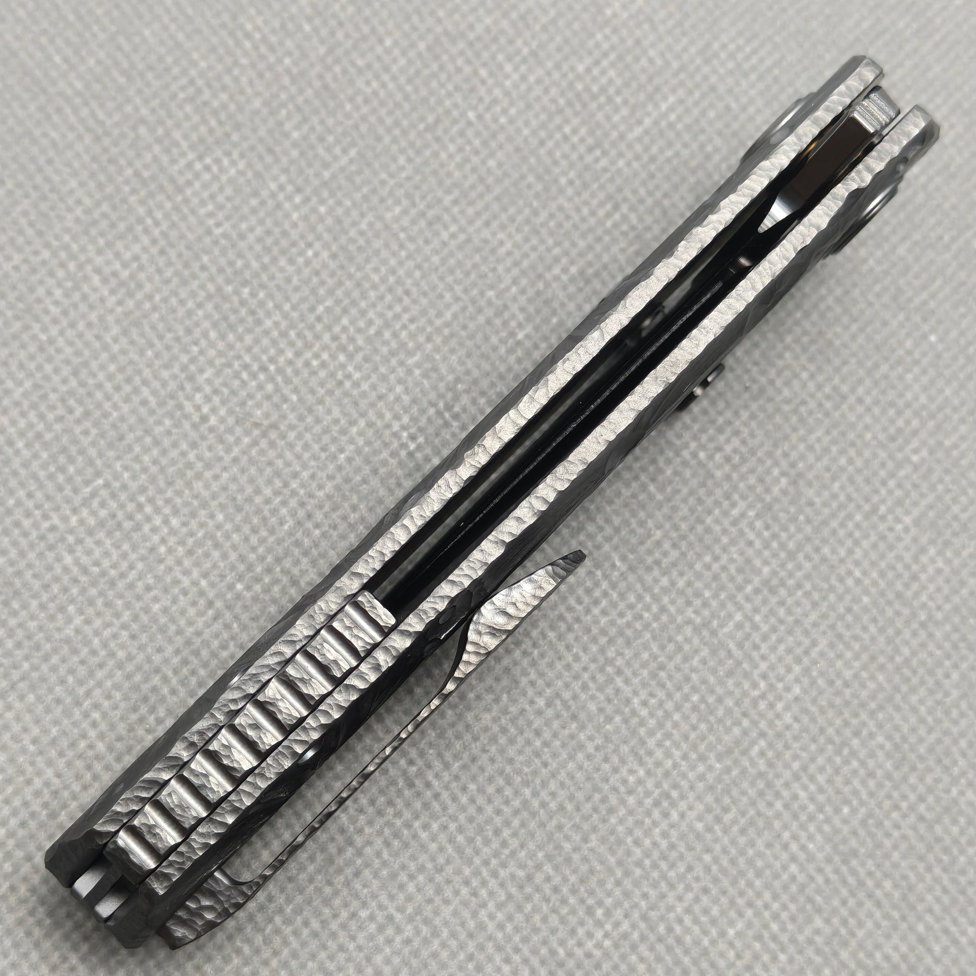 VORIXN KB098 Impact Origin Folding Knife – closed side construction view showing pocket clip, spacer, and handle layers