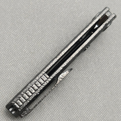 VORIXN KB098 Impact Origin Folding Knife – closed side construction view showing pocket clip, spacer, and handle layers