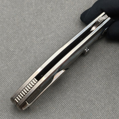 VORIXN KB068 closed side construction view showing pocket clip, spacer, and titanium handle layers.