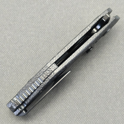 VORIXN Prism KB129 Folding Knife – closed side construction view showing pocket clip, spacer, and handle layers