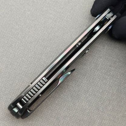 VORIXN Spectra KB127 Folding Knife – closed side construction view showing pocket clip, spacer, and handle layers
