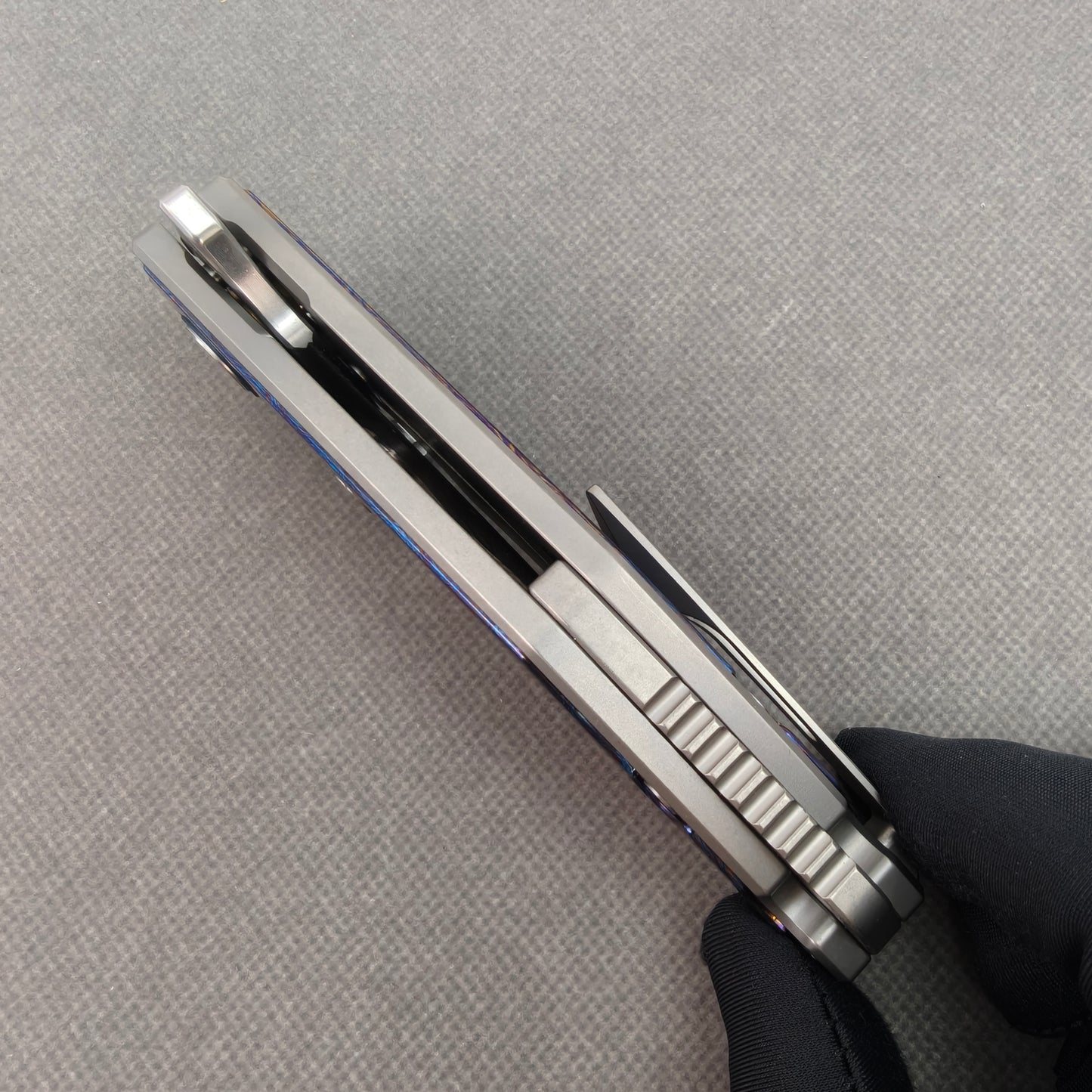 VORIXN KB031 closed side construction view showing pocket clip, spacer, and titanium handle layers.