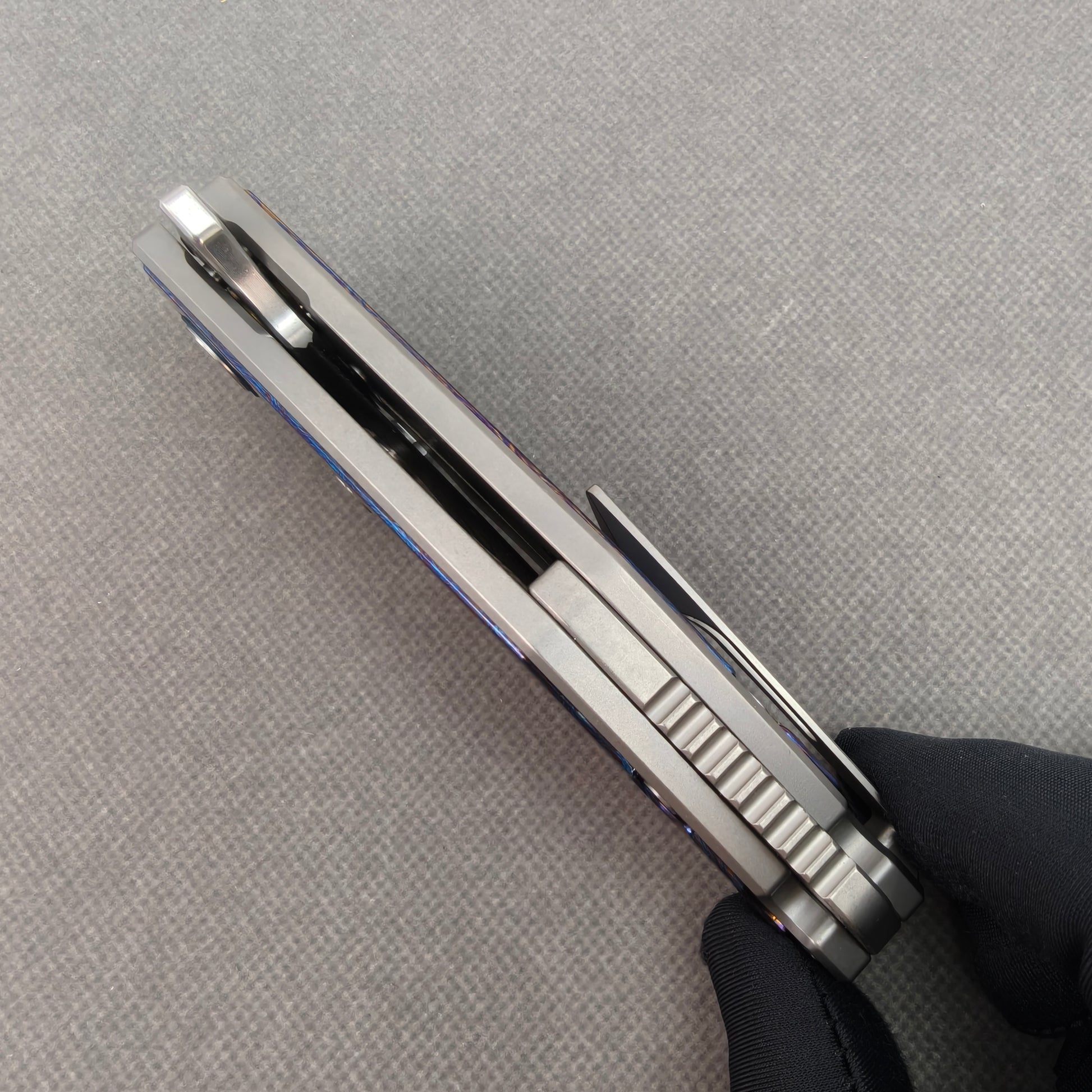 VORIXN KB031 closed side construction view showing pocket clip, spacer, and titanium handle layers.