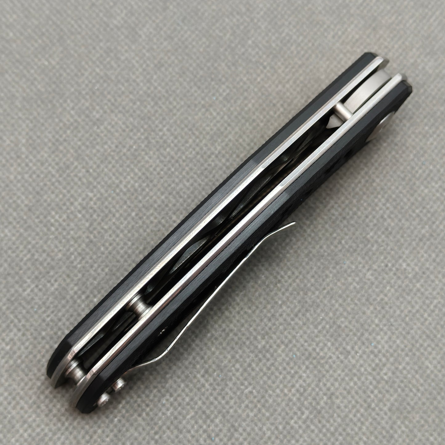 VORIXN KA003 closed side construction view showing pocket clip, spacer, and handle layers.