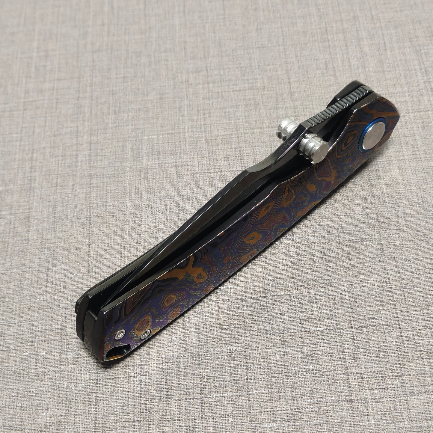 VORIXN Topograph folding knife closed, angled view with blade spine facing upward