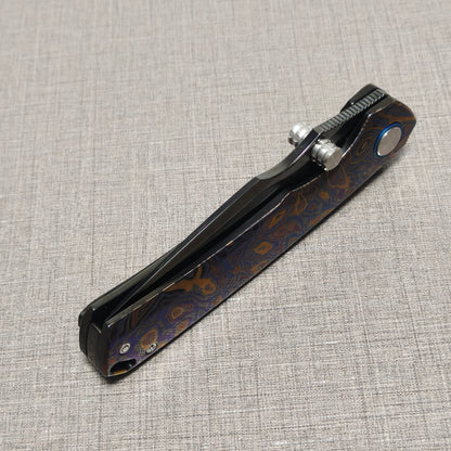 VORIXN Topograph folding knife closed, angled view with blade spine facing upward
