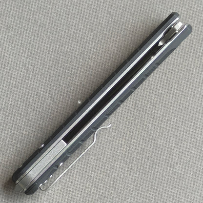 VORIXN KM001 closed side construction view showing pocket clip, spacer, and handle layers.