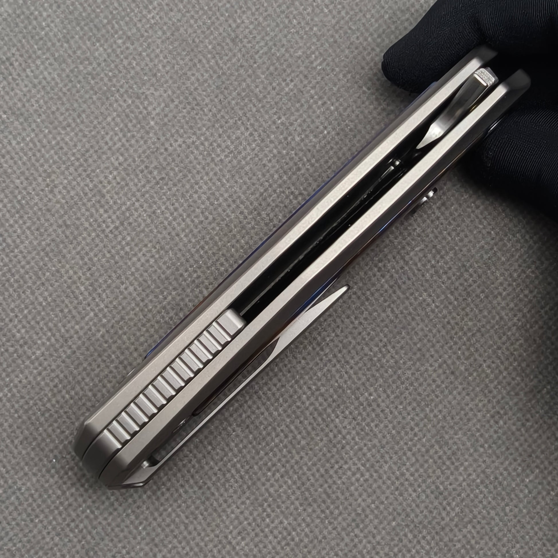 VORIXN KB019 closed side construction view showing pocket clip, spacer, and titanium handle layers.
