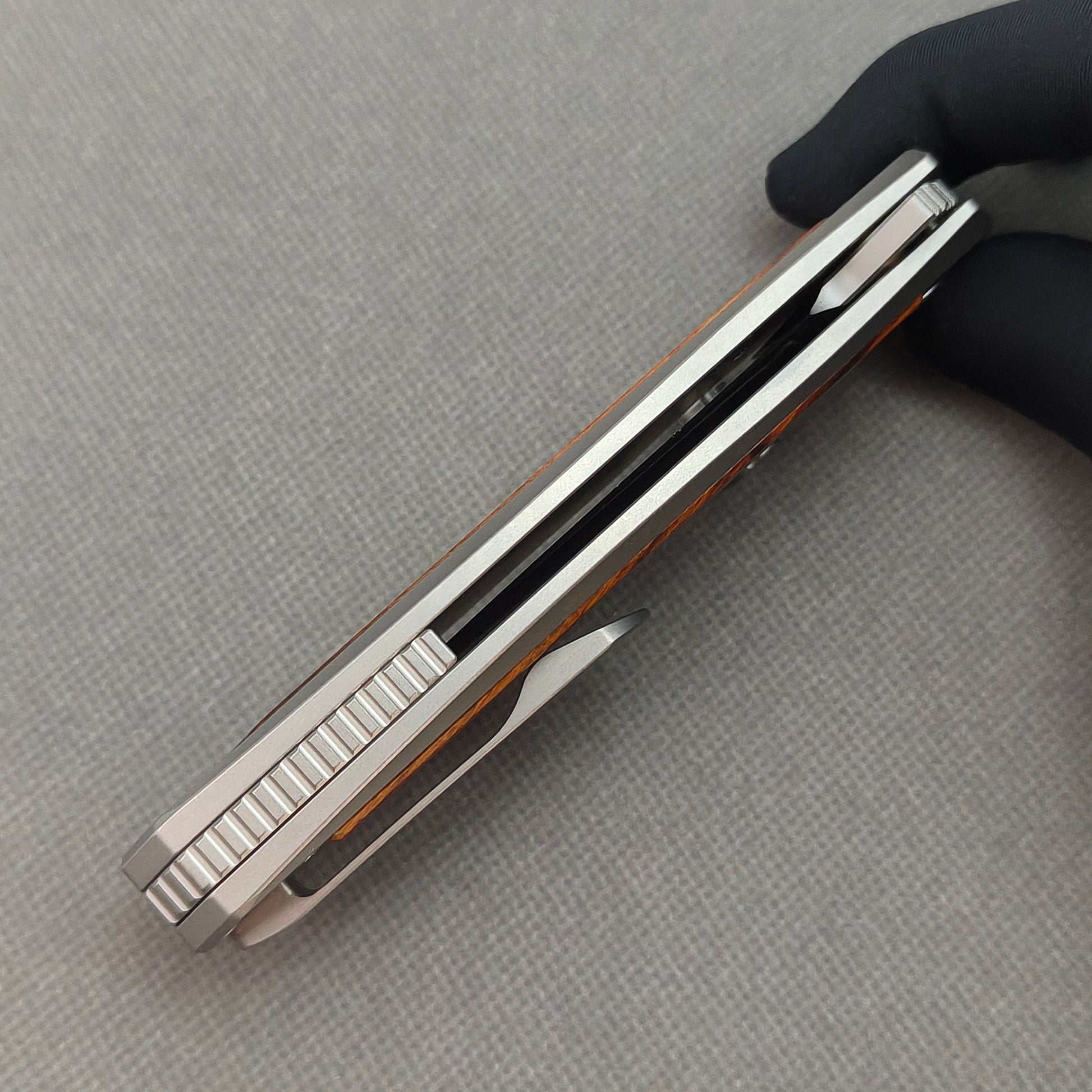 VORIXN KB040 closed side construction view showing pocket clip, spacer, and handle layers.