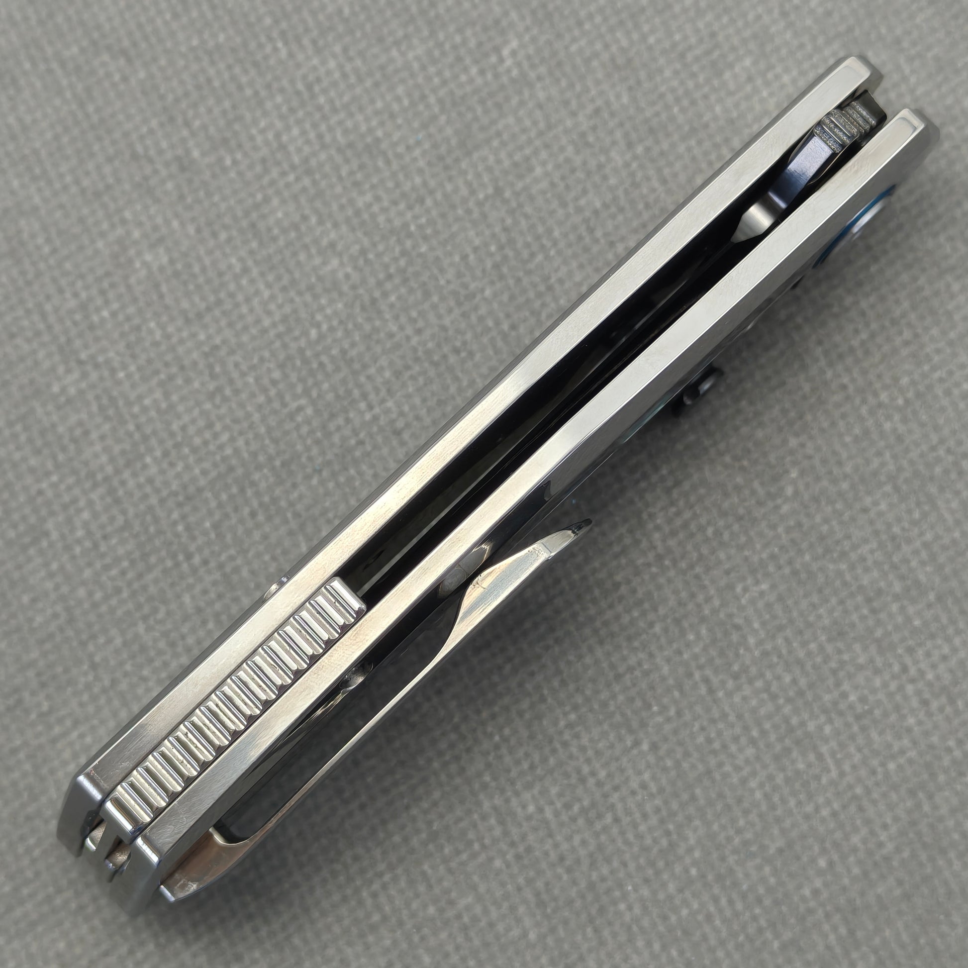 VORIXN Ocean Mirage KB130 Folding Knife – closed side construction view showing pocket clip, spacer, and handle layers