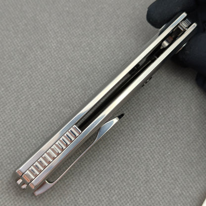 VORIXN KB104 Ocean Mirage Folding Knife – closed side construction view showing pocket clip, spacer, and handle layers