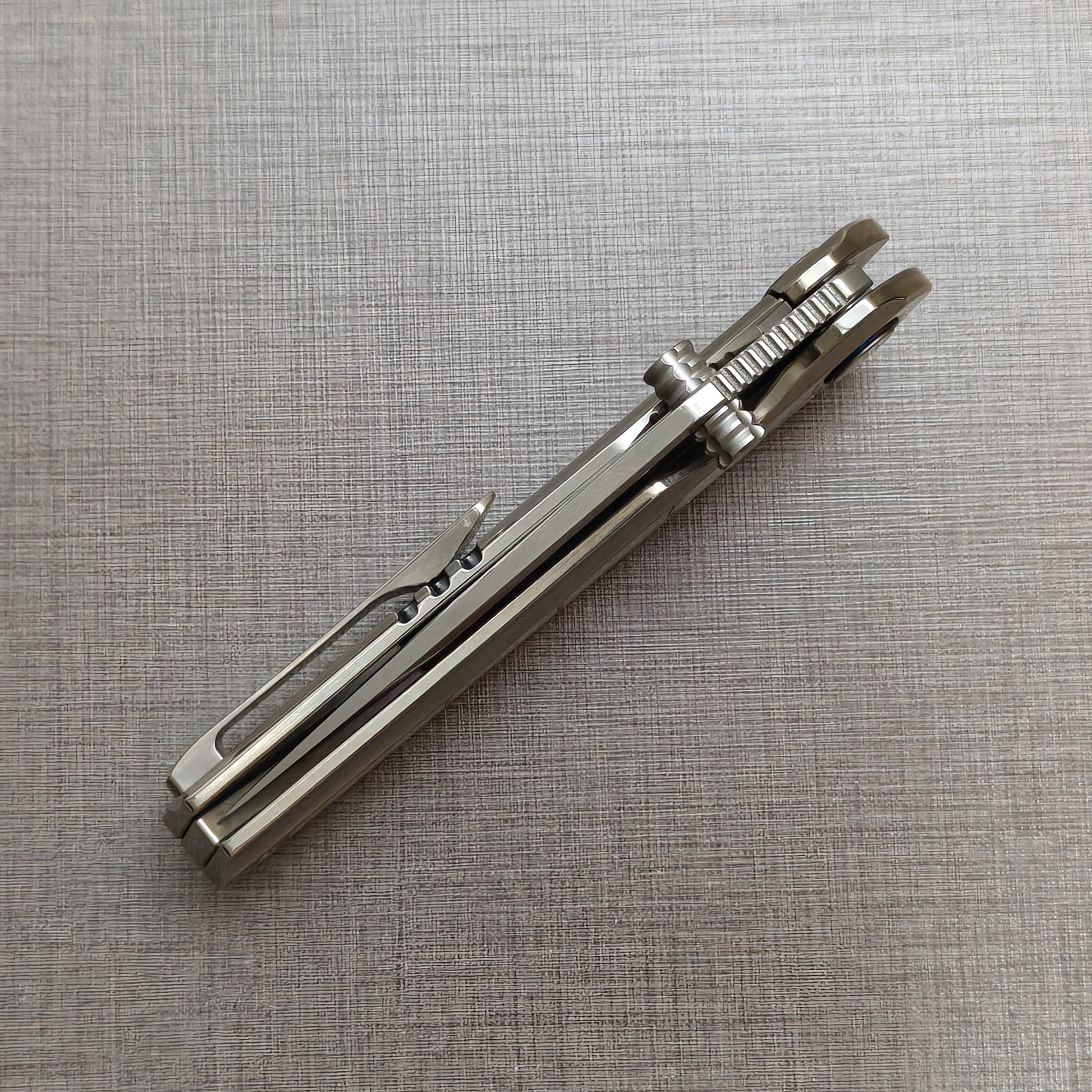 VORIXN Ocean Mirage folding knife closed, angled view with blade spine facing upward